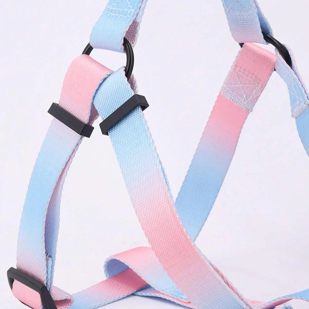 A set of colorful pet harness with leash and dog leash for indoor and outdoor use